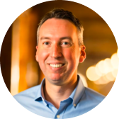 Person in a blue shirt, blurred background